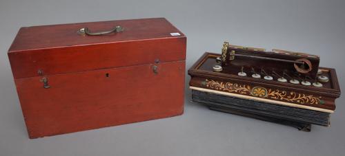 W. Winrow & Sons, a rosewood and inlaid flutina accordion, late 19th century with mother-of-pearl keys and brass fittings, green paper maker's label a