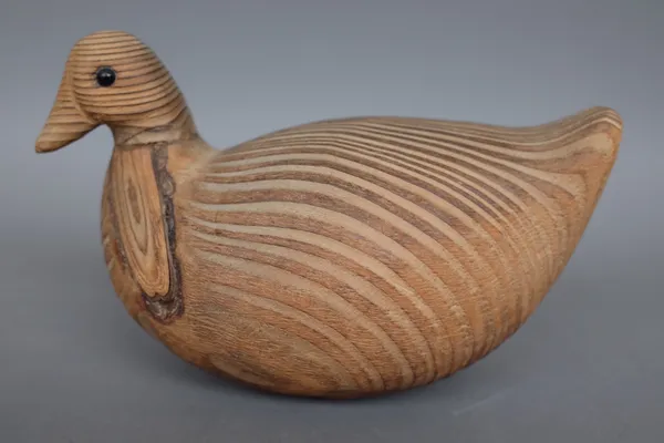 Guy Taplin, (British born.1939) Coot, carved wood of plain naturalistic form, signed to the base, 18.5cm long. DDS
