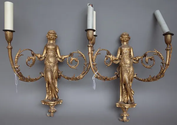 A pair of giltwood figural twin branch wall appliques, 19th century, with central female over a shell carved bracket and foliate scroll branches, back
