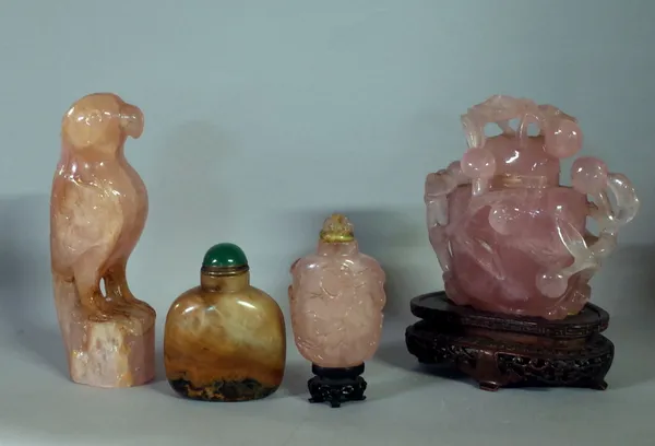Rose quartz ware to include; snuff bottle with raised prunus decoration, 11cms high, a snuff bottle, bird and another snuff bottle (4).