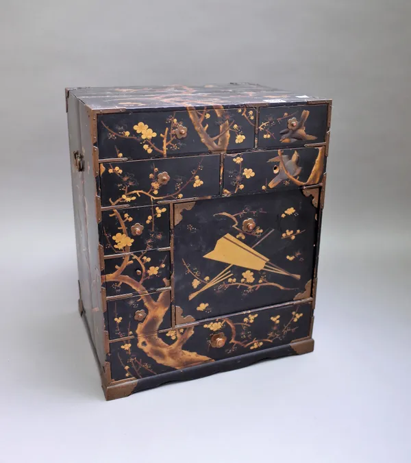 A 20th century Japanese gilt and polychrome lacquer kodansu/table cabinet with an arrangement of various drawers and cupboard, 39cm wide x 47cm high.