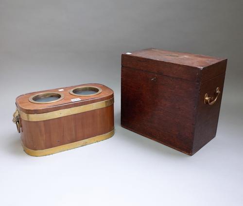 A George III style brass bound mahogany twin bottle stand, 40cm wide, together with a Victorian oak silver box, Widdowson & Veale Silversmiths, 73, St