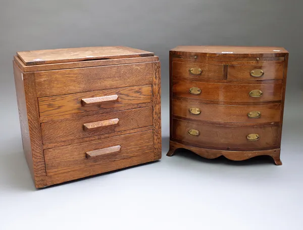 A 20th century mahogany diminutive bowfront chest, with brushing slide over two short and three long graduated drawers on splayed bracket feet, 38cm w