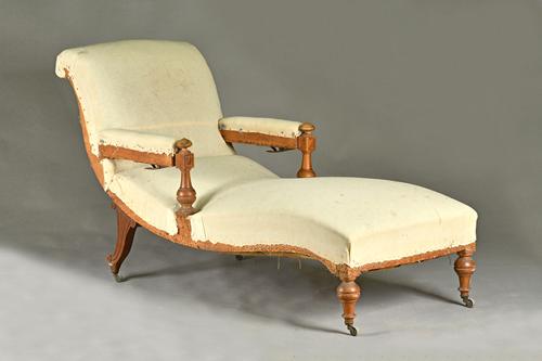 A 19th century French walnut framed open arm reclining chaise longue, on turned supports, 72cm wide x 165cm long.