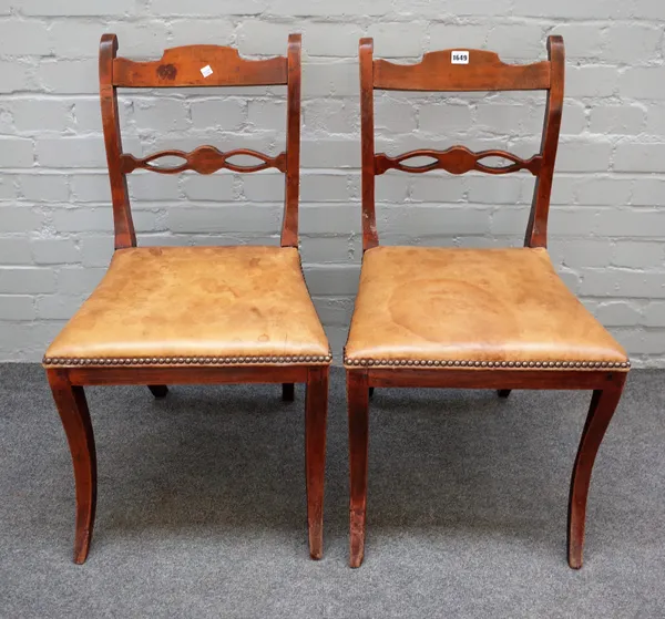 A pair of Continental early 19th century stained beech side chairs, on sabre supports, 47cm wide x 81cm high, (2).