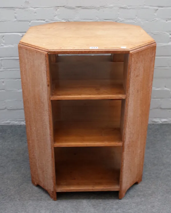 Probably Heals; a limed oak octagonal free-standing three tier bookcase, 59cm wide x 77cm high.