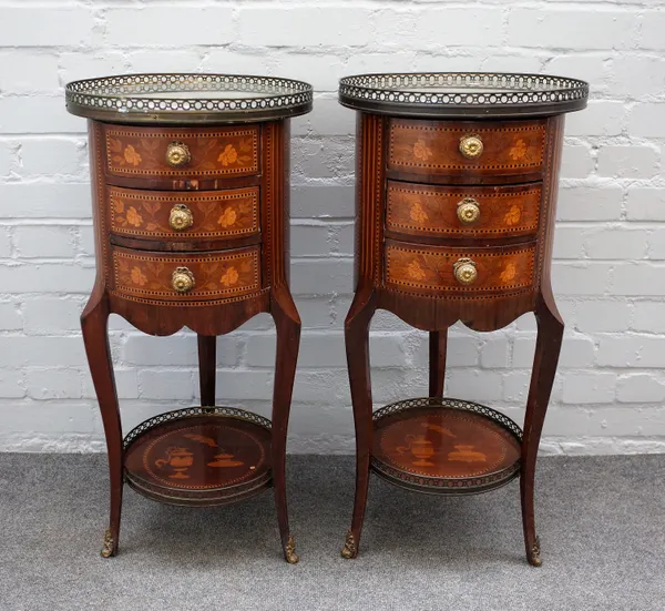 A pair of 20th century French gilt metal mounted cylindrical mahogany three drawer occasional tables with extensive marquetry inlay, 37cm diameter x 7