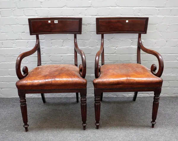 A pair of Regency mahogany carver chairs, on tapering reeded supports, 57cm wide x 90cm high, (2).