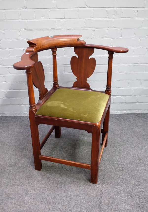 A George III walnut double vase back corner chair on chamfered block supports, 75cm wide x 83cm high.