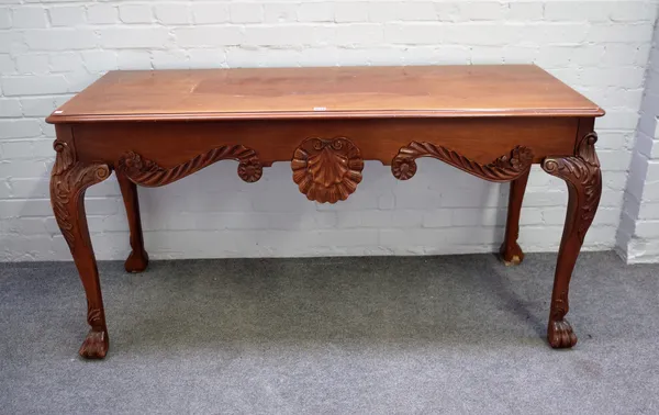 An 18th century style mahogany serving table with shell carved frieze on paw feet, 149cm wide x 76cm high.