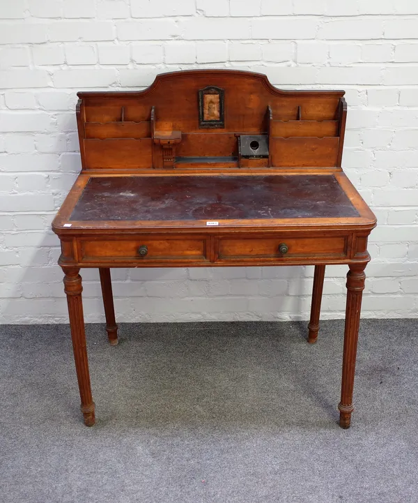 A late Victorian walnut writing desk with fitted super structure over pair of drawers on tapering fluted supports, 92cm wide x 106cm high.