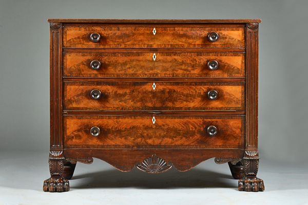 A Regency mahogany straight front chest of four long graduated drawers on carved lions paw feet, 131cm wide x 105cm high. Illustrated