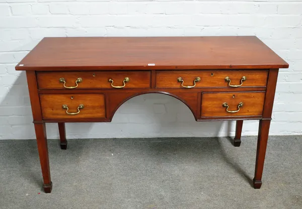 A 19th century mahogany writing desk with four drawers about the arch knee, on tapering square supports, 133cm wide x 78cm high.