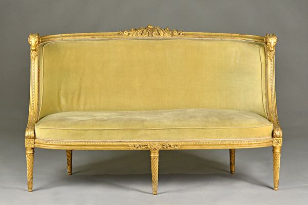 A Louis XVI style canape/sofa with ram's head finials and spiral fluted supports, 150cm wide x 88cm high.