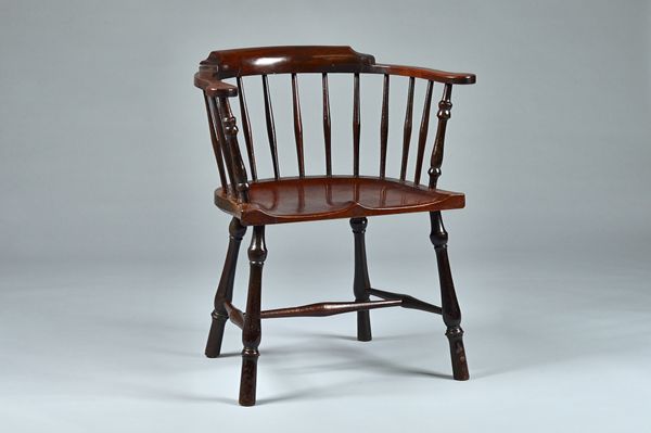 A mid-18th century mahogany and fruitwood bow back Windsor chair with saddle seat on turned supports, 62cm wide x 82cm high.  Illustrated