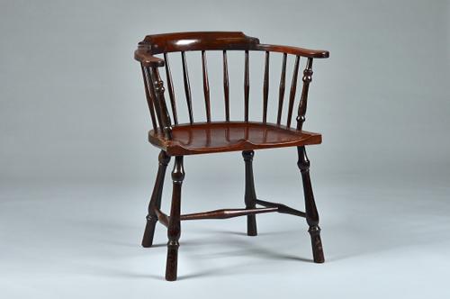A mid-18th century mahogany and fruitwood bow back Windsor chair with saddle seat on turned supports, 62cm wide x 82cm high.  Illustrated