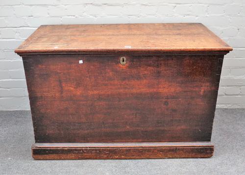 A George III oak rectangular lift top trunk on plinth base, 110cm wide x 70cm high.