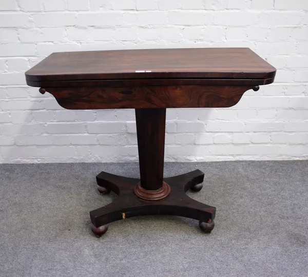 A William IV rosewood card table on tapering octagonal column and quatrefoil platform, 92cm wide x 74cm high.