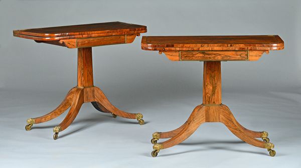 A pair of Regency brass inlaid rosewood tea tables, each on compressed octagonal column and four downswept supports, 91cm wide x 75cm high.  Illustrat