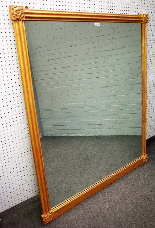 A Victorian gilt framed rectangular mirror with channelled frame and Tudor rose corners, 137cm wide x 163cm high.