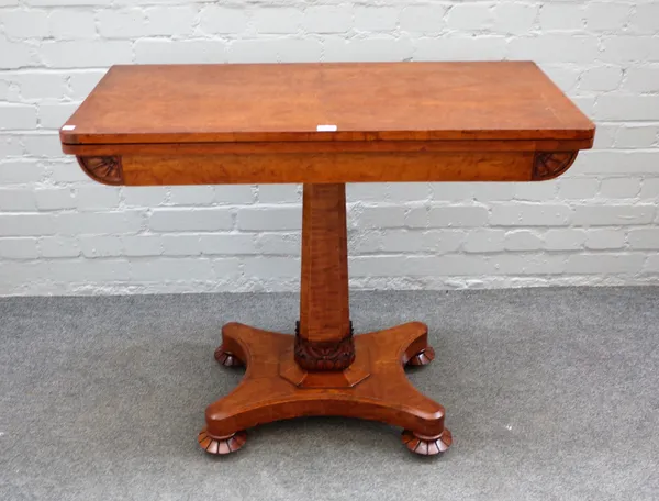 A William IV Birdseye maple foldover card table on canted square column and quatrefoil platform, 92cm wide x 75cm high.