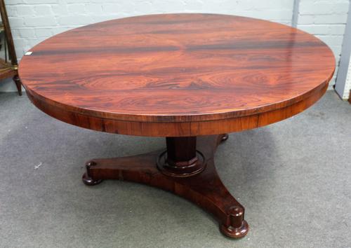 A William IV rosewood circular snap top centre table on octagonal column and tri-form platform, 130cm diameter x 72cm high.