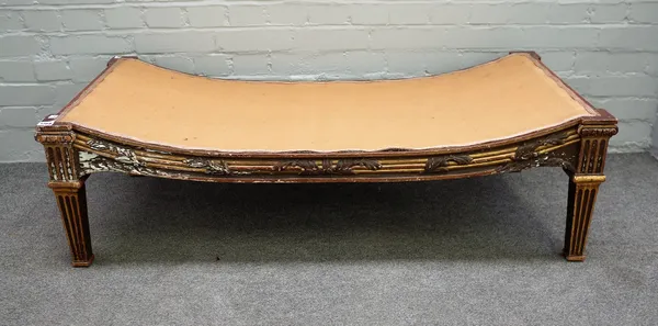 A Louis XVI style gilt rectangular stool with concave seat on channelled tapering square supports, 125cm wide x 38cm high.