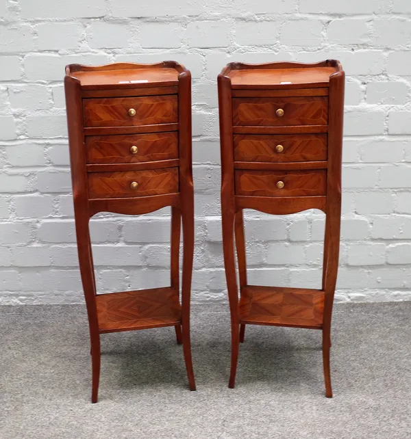 A pair of Louis XV style inlaid kingwood four drawer bedside tables, of serpentine outline, 24cm wide x 74cm high, (2).