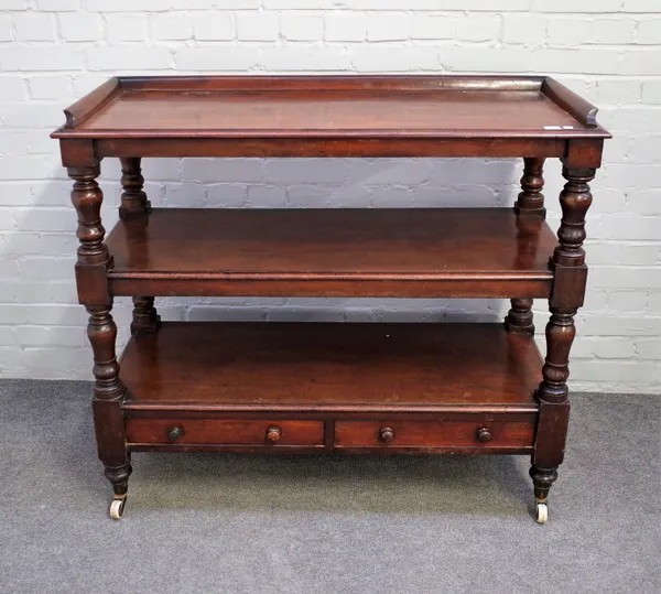 A Victorian mahogany three tier serving buffet with two lower drawers on baluster turned supports, 115cm wide x 101cm high.