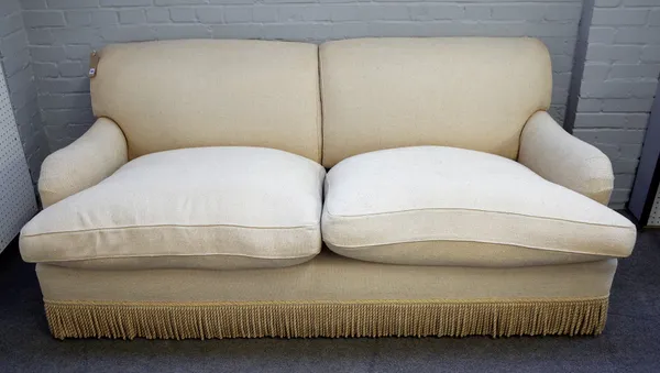 In the Manner of Howard & Sons, a beige upholstered two seater sofa, 200cm wide x 85cm high.