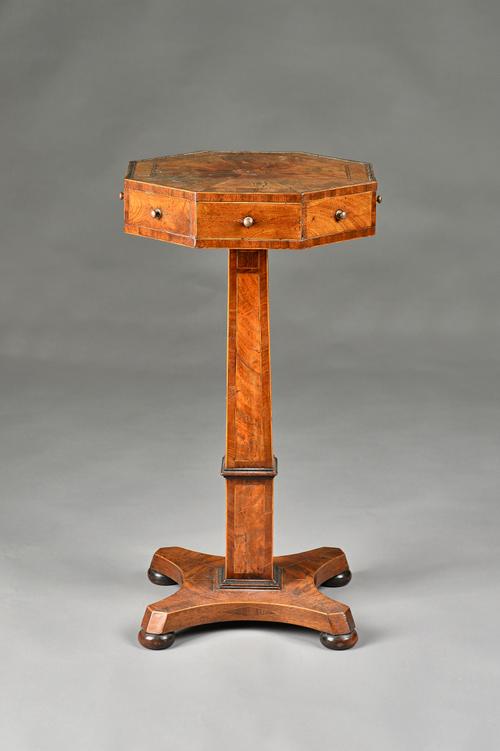 A George IV mahogany octagonal top occasional table, with four frieze drawers, on slab column, 36cm wide x 70cm high..