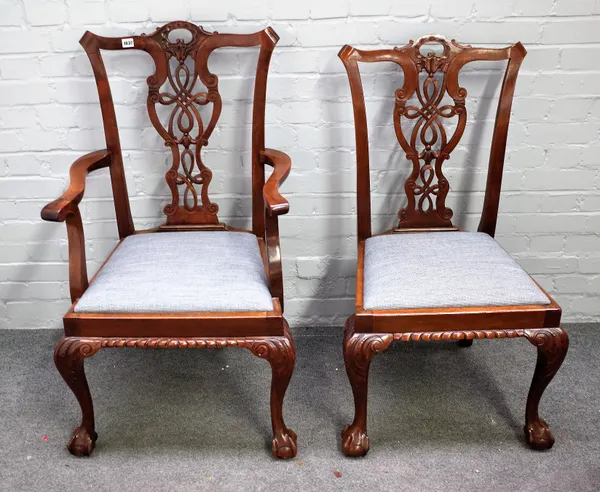 A set of six mid-18th century style mahogany dining chairs, circa 1900, with pierced splat on claw and ball feet, including a pair of carvers, (6).