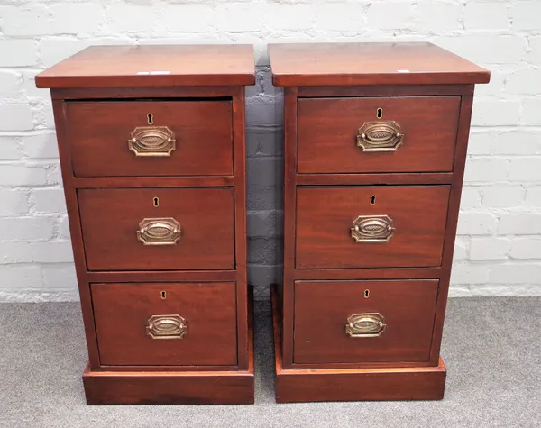 A pair of mahogany three drawer pedestals on plinth bases, 38cm wide x 73cm high.