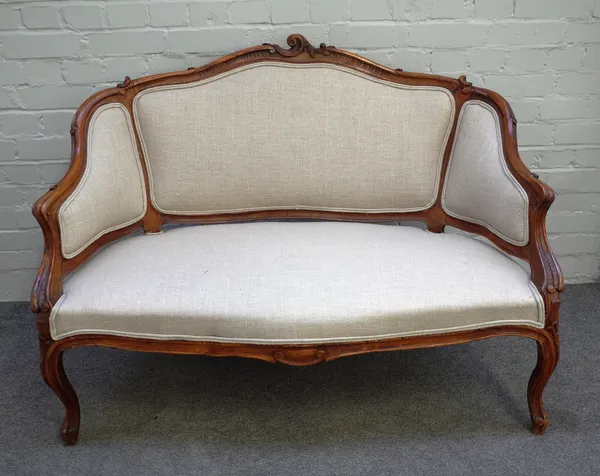 A Louis XV style carved walnut sofa with serpentine seat on scroll supports, 124cm wide x 89cm high.