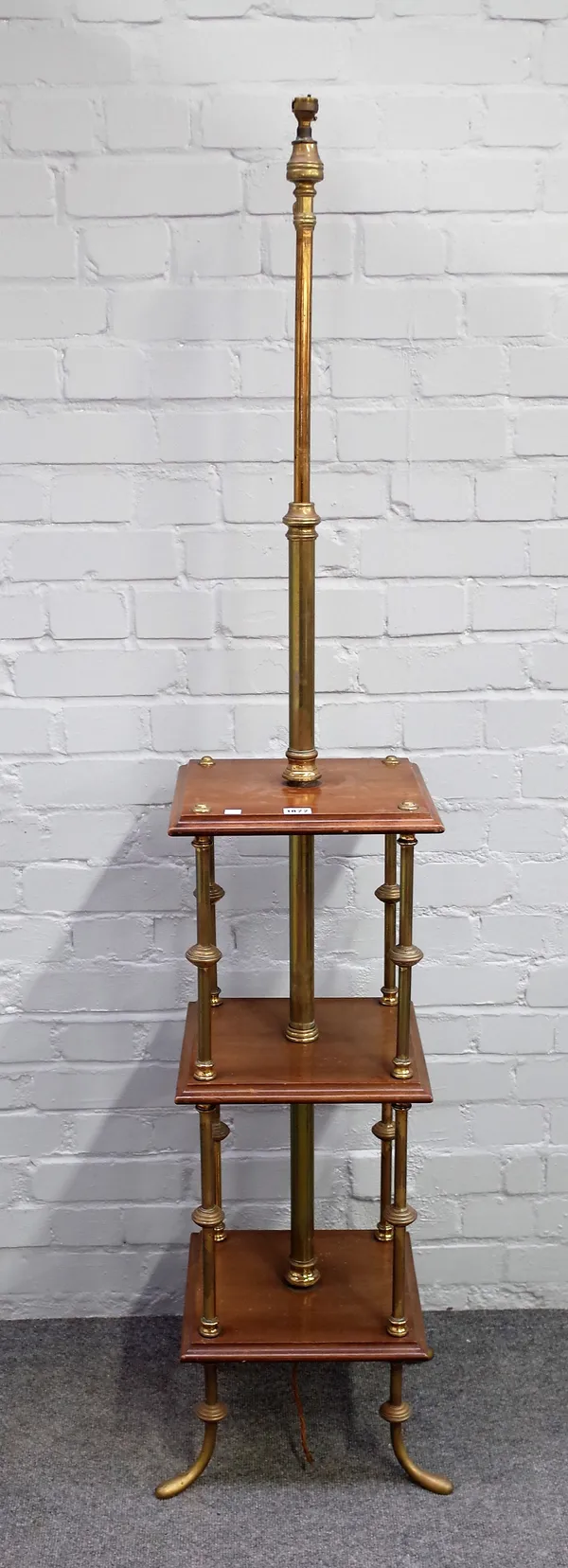 An early 20th century mahogany and brass three tier whatnot with integral standard lamp, 32cm wide.