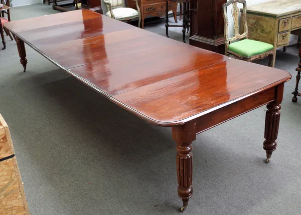 An early Victorian mahogany extending dining table on turned and reeded supports, three extra leaves, 129cm wide x 124cm long x 356cm long extended.