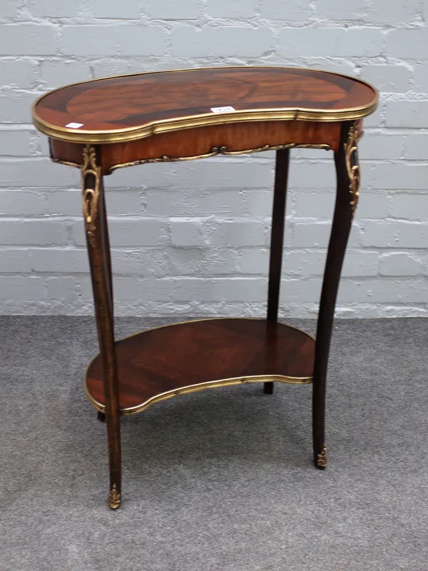 A late 19th century French gilt metal mounted rosewood and walnut kidney shaped two tier occasional table, 55cm wide x 73cm high.