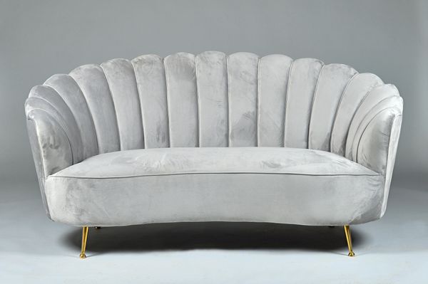A retro design grey upholstered shell back sofa with concave seat on lacquered brass supports, 180cm wide x 88cm high. Illustrated