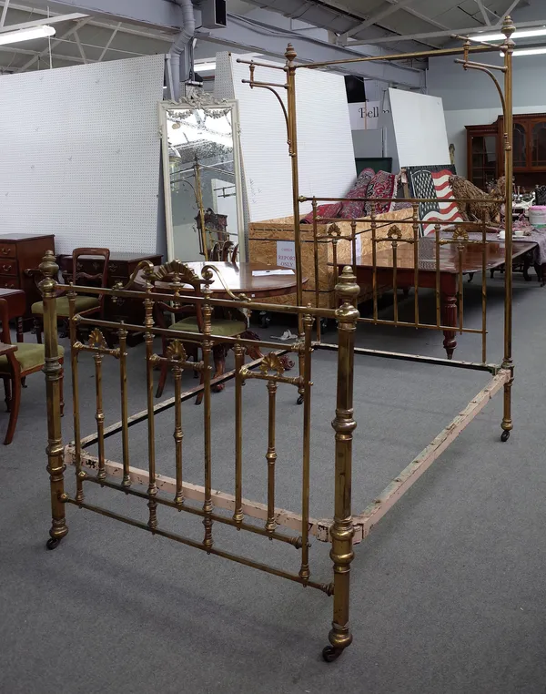 An early 20th century brass tester double bed with turned decoration, 140cm wide x 231cm high x 210cm long.