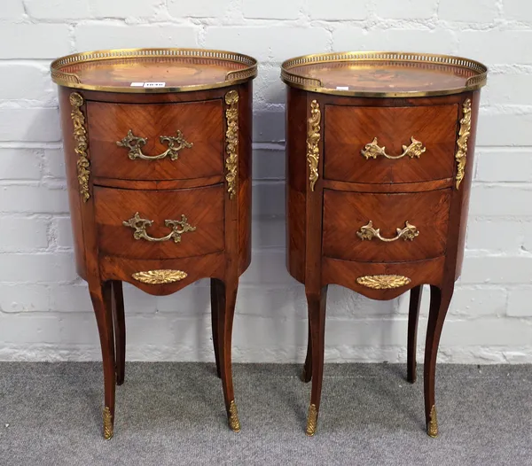 A near pair of 18th century French style gilt metal mounted marquetry inlaid oval two drawer side cabinets on splayed supports, 34cm wide x 69cm high.