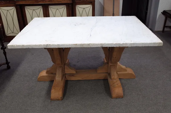 A centre table, the thick slab rectangular marble top on a joined bleached oak base, 153cm wide x 79cm high.