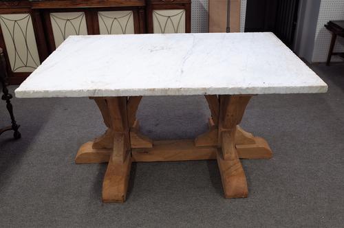 A centre table, the thick slab rectangular marble top on a joined bleached oak base, 153cm wide x 79cm high.