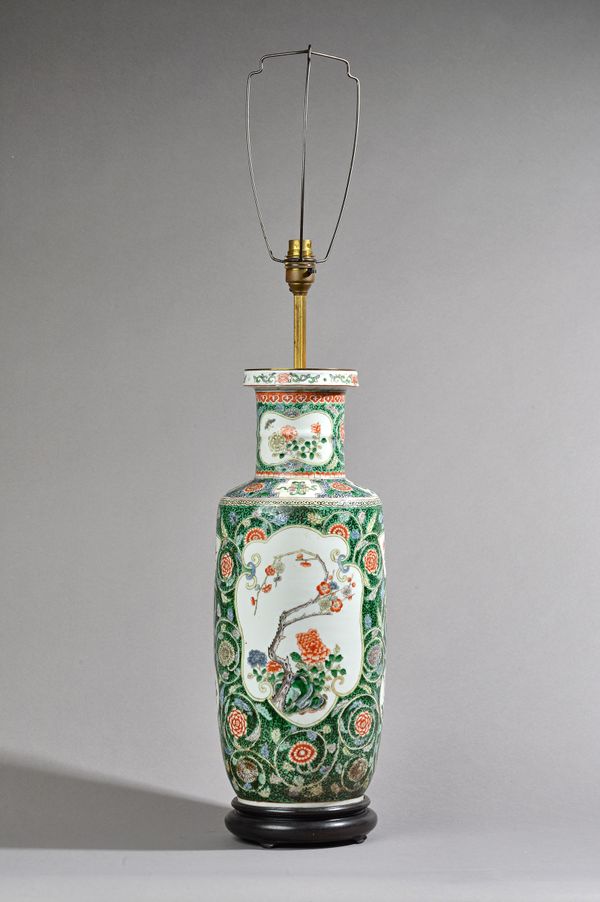 A Chinese famille-verte rouleau vase adapted as a lamp, late19th century, painted with two large and six small panels of flowers and shrubs, the shoul
