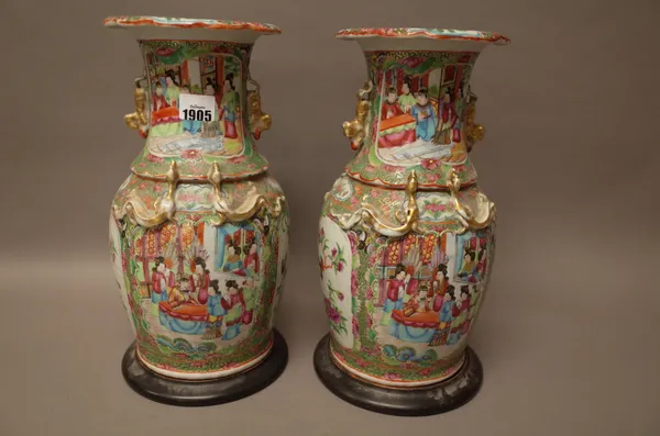 A pair of Canton famille-rose baluster vases, 19th century, painted with figurative panels alternating with panels of insects and birds in branches, 3