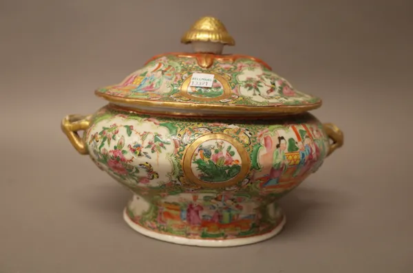A Canton famille-rose two-handled oval tureen and cover, 19th century, typically painted with panels of figures, flowers and birds in branches, 28cm.