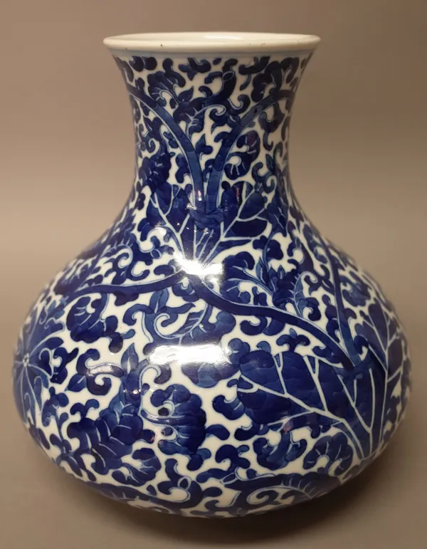 A Chinese blue and white pear-shaped vase painted with lotus and foliage, 19th century, 23.5cm. high.