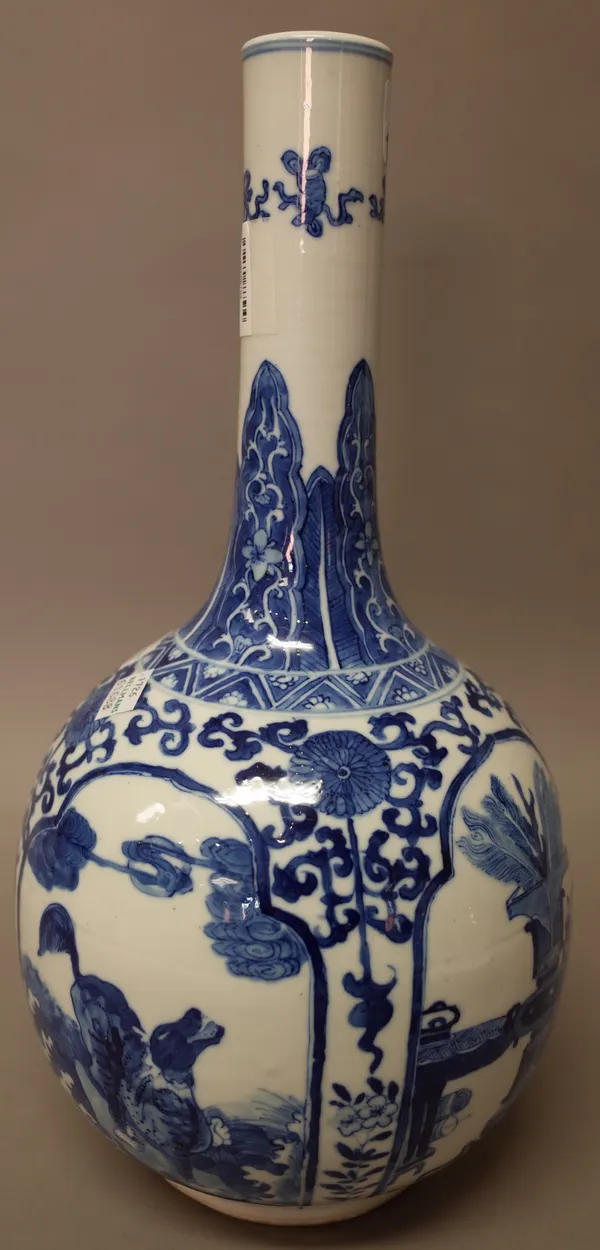 A Chinese blue and white bottle vase, 19th century, painted with panels of mythical beasts alternating with panels enclosing vases, censers and stands