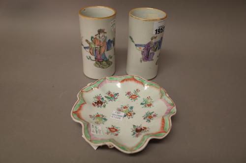 A pair of small Chinese famille-rose cylindrical vases, 20th century, each painted with an official and attendant in a landscape, iron-red seal marks,