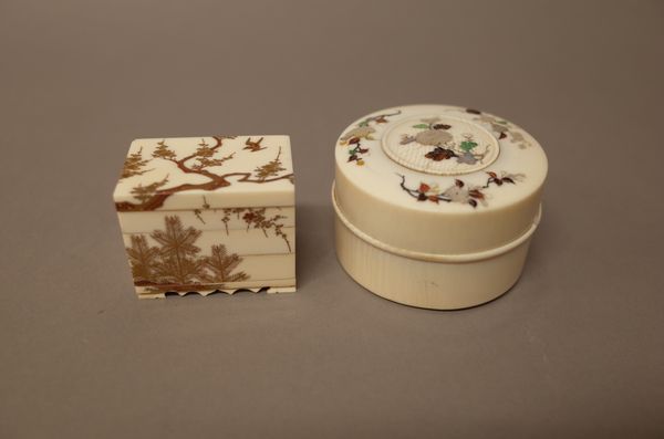 A Japanese inlaid ivory and Shibayama style circular box and cover, Meiji period, the cover inlaid with a central chrysanthemum spray inside three bra