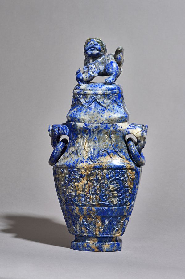 A large Chinese lazurite two-handled vase and cover, 19th century, of flattened baluster form, carved with taotie masks between cicada borders, set wi